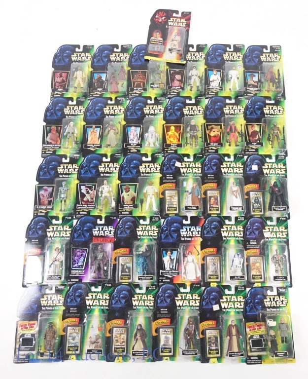 1999 Star Wars Action Figures (31): Lot of 31 Star Wars action figures. Produced by Kenner in 1999. Includes: Princess Leia in Ceremonial Dress with Medal of Honor, R2-D2 with Launching Lightsaber, Aunt Beru with Service Droid, Darth Va