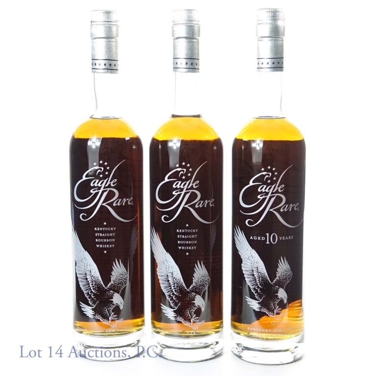 Eagle Rare Bourbon Whiskey 10 Year (3)*: THREE bottles of: Eagle Rare Kentucky Straight Bourbon Whiskey aged 10 years, 90 proof, 750 ml. * One of the bottles has a significant chip at the bottom rim and label on back-- however, this exterior