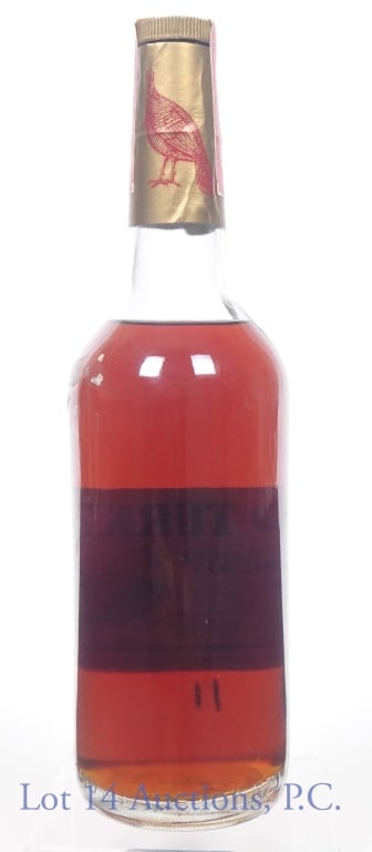 1979 Wild Turkey Bourbon Whiskey (No Front Label): Wild Turkey Kentucky straight bourbon whiskey. 8 years. 101 proof. 750 ml (25.4 fl oz). Series 112 (ATF) tax strip (1977 - 1982). Front label is missing.