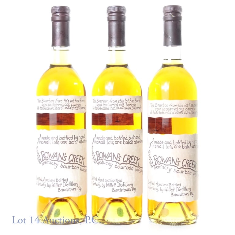 Rowan's Creek Straight KY Bourbon (3): Three bottles of: Rowan's Creek Straight Kentucky Bourbon Whiskey. Made and bottled by hand in small lots, one batch at a time. Symbol of quality DSP-KY-78. Two bottles are batch no. 21-23; the remain