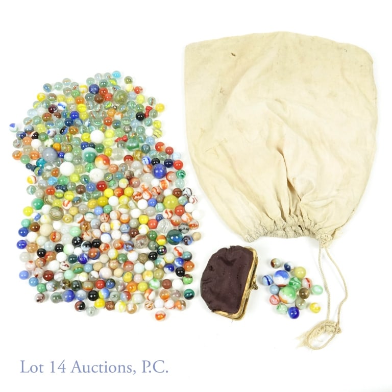 5 Pounds Of Marbles - Glass With Some Clay: 5 pounds of marbles. We saw 6 marbles we think are made of clay with the rest being made of glass. There are a variety of sizes and designs. Some of the larger marbles have chips from being played wit