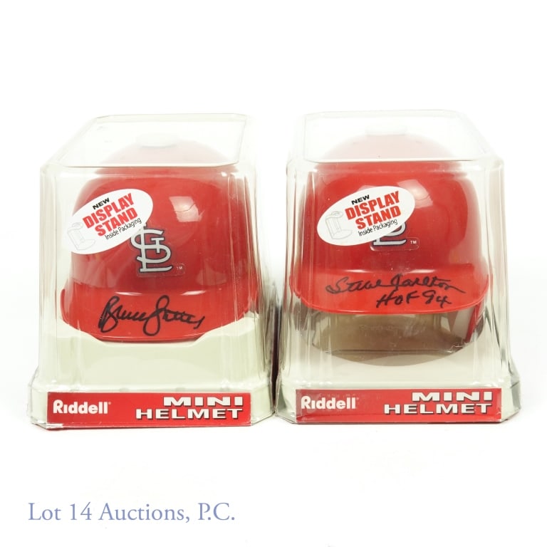 Steve Carlton & Bruce Sutter Signed Mini Helmets: Two Riddell mini helmets, one signed by Steve Carlton and the other by Bruce Sutter. The Carlton mini helmet has a hologram from STAT Authentic. The Sutter mini helmet has a COA from Ironclad.