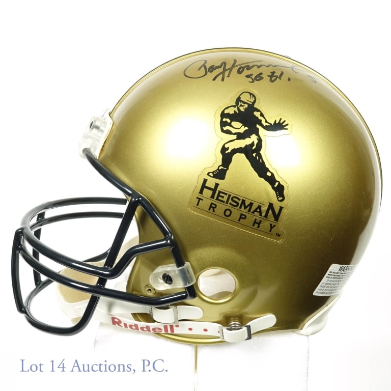 Marcus Allen And Paul Hornung Signed Helmet: Full-size, authentic (non-replica) Riddell Heisman Trophy helmet signed by Marcus Allen and Paul Hornung. Both signed with a Black Sharpie with Allen adding "81" and Hornung adding "56 H". There is no