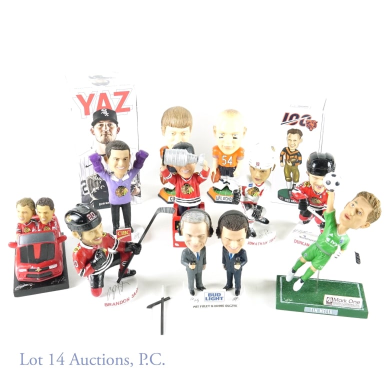 Sports Bobbleheads (12): Sports bobbleheads - Chicago Blackhawks, Chicago White Sox. Chicago Bears. Two with box. Includes: Brian Urlacher, Red Grange, Yasmani Grandal, Jonathan Toews, Patrick Kane, Eddie Olczyk, Patrick Kane