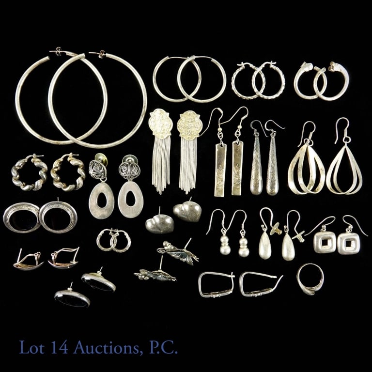Sterling Silver Earrings (20 + 1): Lot of twenty pairs of sterling silver earrings and one ring. Only two of the earrings have stones. Sizes range from .6-2.25". One of the designer pairs is embossed WM Rogers. Total weight (excluding 