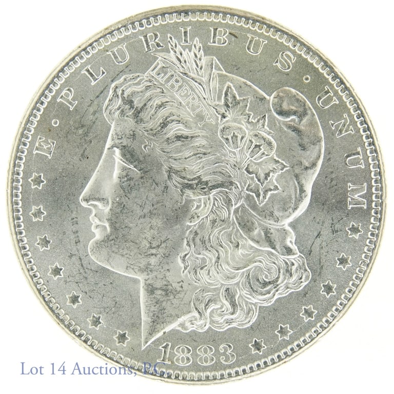 1883-cc Morgan Silver Dollar (BU?): 1883-cc Morgan dollar (Carson City Mint). 90% silver (electronically verified in our shop). Per consigner, brilliant uncirculated. 26.7 grams on our scale. 38.0 mm diameter. *** Lot 14 Auctions is not