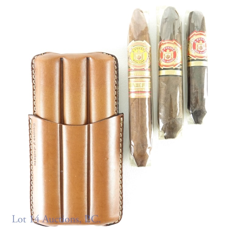 A Fuente Cigars (3) - 2 Hemingway & Leather Case: 3 Arturo Fuente cigars: Gran Reserva Hemingway Work of Art (4.5" long, app. 3" circumference) *** Gran Reserva Hemingway Short Story (4" long, app. 2.5" circumference) *** Rare Pink 1960 Happy Ending 