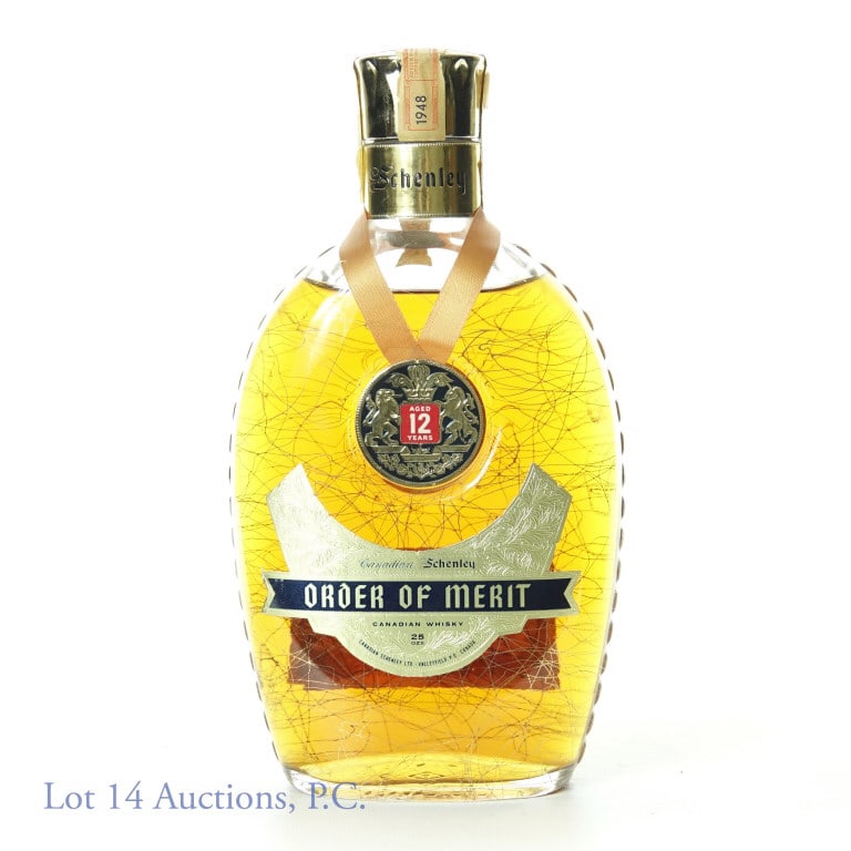 1960 Order of Merit Schenley Canadian 12 Yr Whisky: Schenley Order of Merit Canadian Whisky. Aged 12 years and blended in Canada. 80 proof. 25 ozs. Placed in charred white oak casks in November 1948 and bottled in November 1960. Bottle No. 143387. Seal