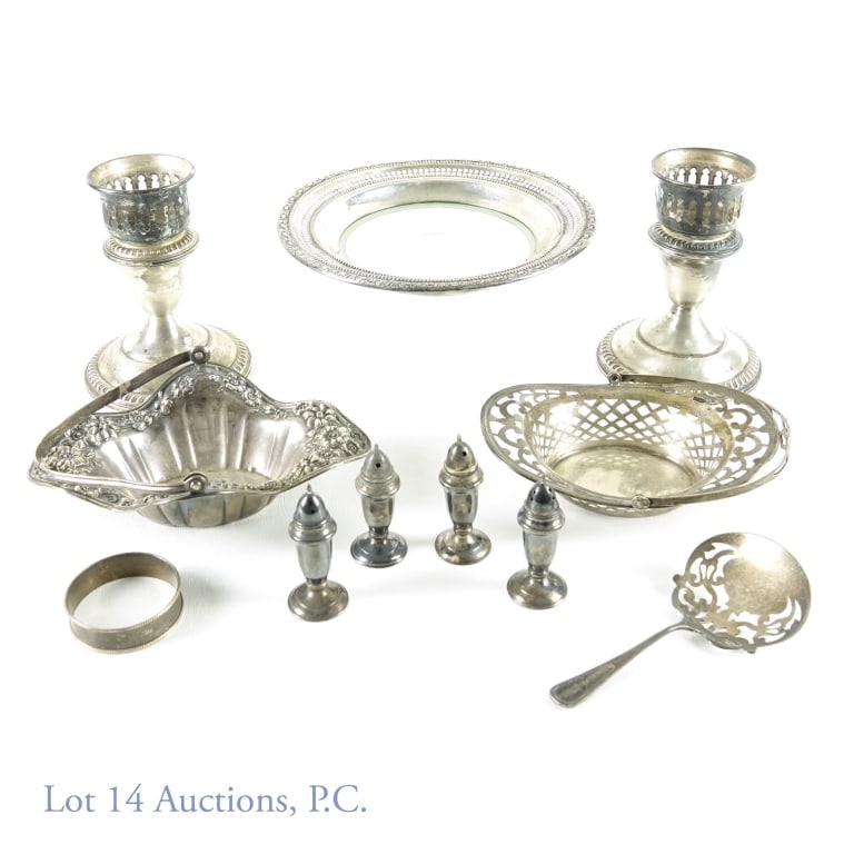 Sterling Silver Tableware and Decorative Pieces: Sterling silver lot, all marked sterling. Includes pair of weighted candlestick holders (4.5 x 3.5"); floral decorative basket (not including handle - 6 x 4 x 2"); cut-out decorative basket (not inclu