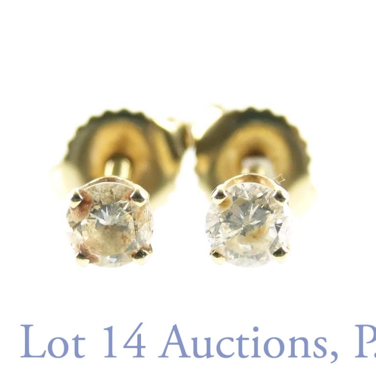14k Gold and Diamond Stud Earrings: Pair of 14k yellow gold and .25ct (each) diamond earrings. Screw back. Total weight: 1.1g / .7dwt.