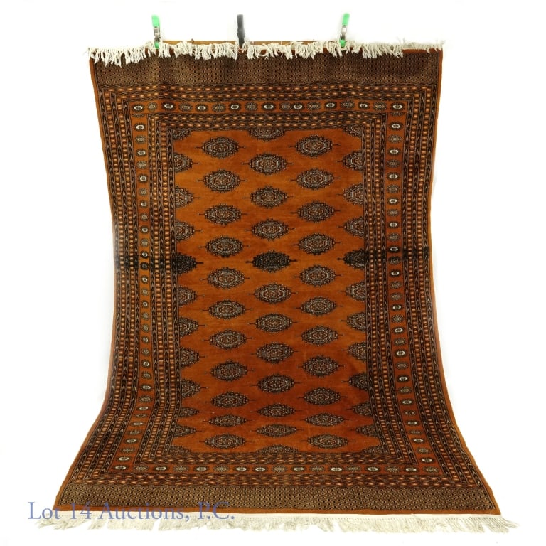 Hand-Knotted Handmade 6x10' Bokhara: Copper with black and white/grey wool Bokhara hand knotted rug. 6 x 10'. Made in Pakistan. No staining, discoloration or damage observed. Please note that emblems and border have darker stitching or b