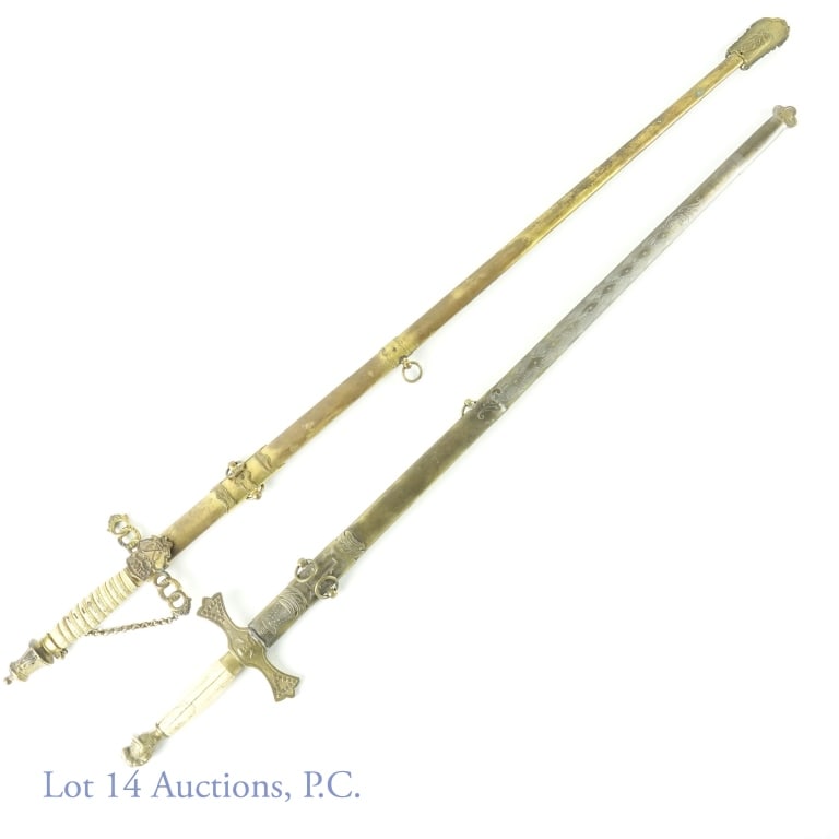 Fraternal Ceremonial Swords (2): 2 fraternal swords. One sword is marked GUOOF (Grand United Order of Odd Fellows). M.C. Lilley Co. Cleveland, Ohio. 30.25" blade. Signs of wear on sword and brass scabbard ***** The other sword appear