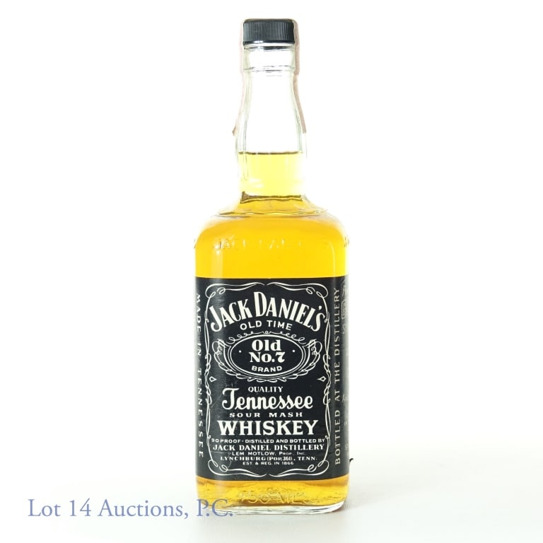 Jack Daniel's Old No. 7 Whiskey (1983 or 85?): Jack Daniel's Old No. 7 Tennessee sour mash whiskey. 90 proof. 750 ml. Non-series ATF tax strip (1983 - 1985). There is either an "83" or "85" embossed on bottom of the glass - it is difficult to read