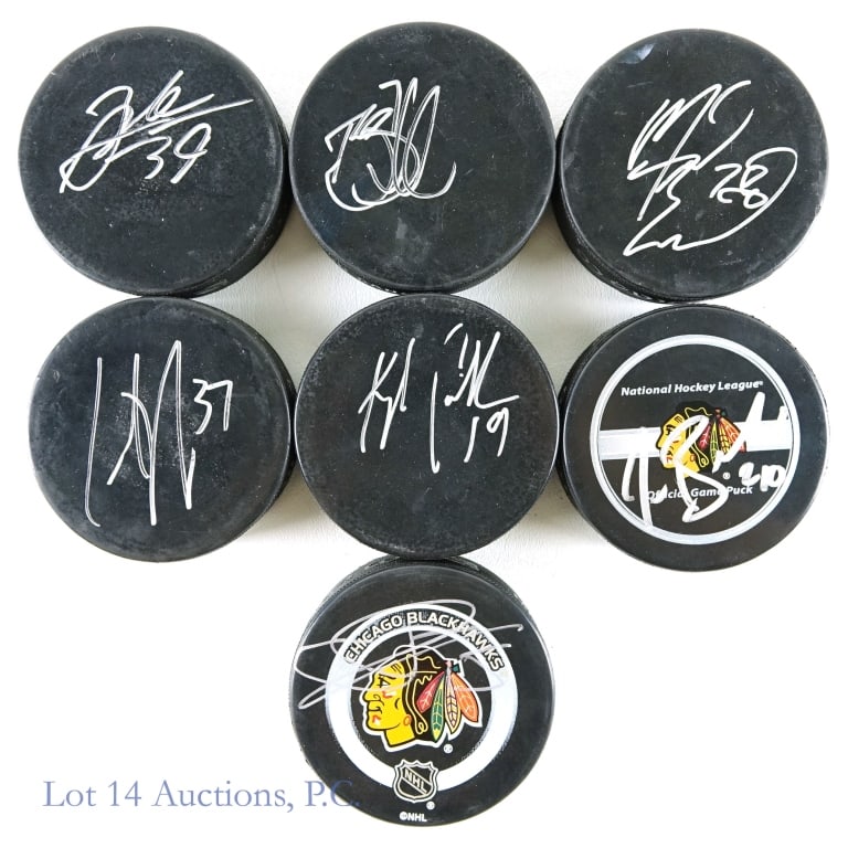 NHL Player Signed Hockey Pucks (7): Collection of 7 signed hockey pucks. Signed pucks are from Tuomo Ruutu, Jared Bell, Kyle Calder, Todd Simpson (with who we think is Brent Seabrook on the other side), Curtis Brown, Michael Nylander (w