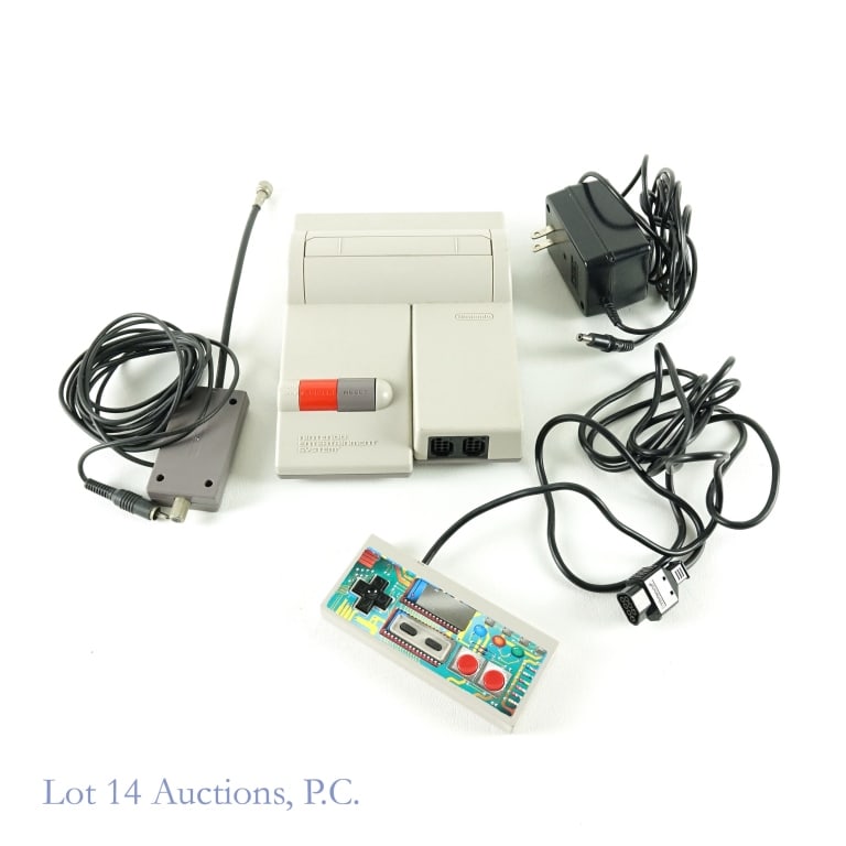 Mini Nintendo NES Video Game System (Top Load): Mini Nintendo NES video game system (top load). Includes system, TV connector cable, Nintendo AC adapter, and one controller. Untested.