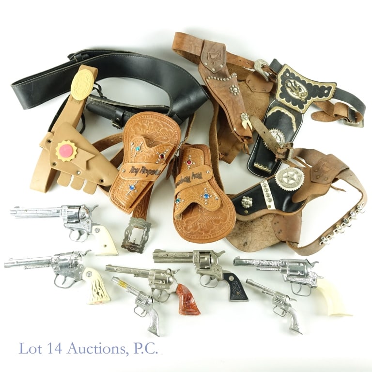 Cap Guns (7) + Gun Belts / Holsters: 7 cap guns. Models / makers include Pony Boy, Kilgore Pal (x2), Nichols Stallion, Spitfire, Stallion 38, and one with an unknown manufacturer marked "Sheriff", with tape holding the plastic sides of t