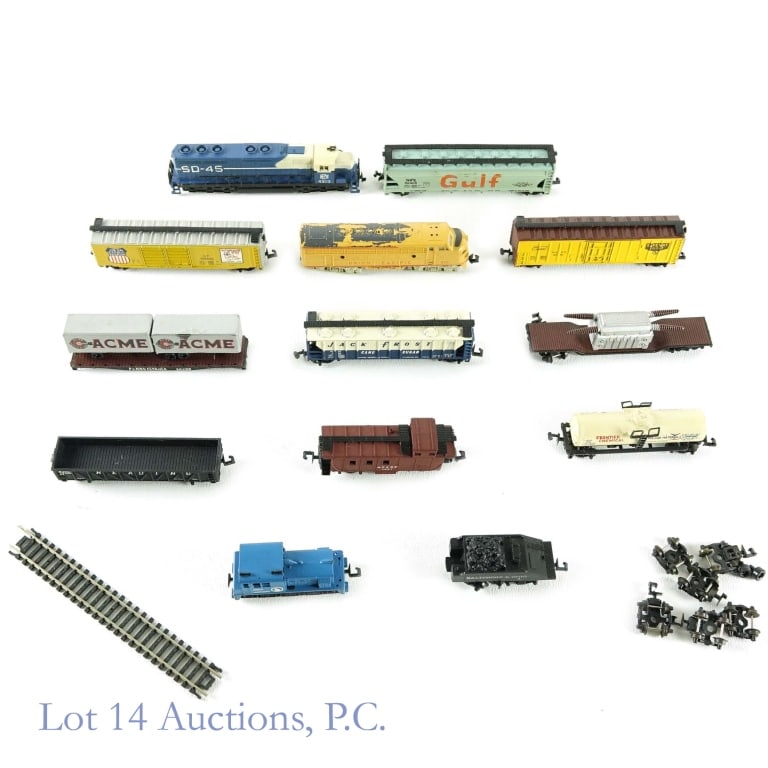 N Gauge Train Cars + Locomotives (Some European): Collection of "N" Gauge train cars and locomotives. Great Northern locomotive *** Atlas Yugoslavia 4353 SD-45 locomotive *** Trix 2961 Union Pacific locomotive (some paint missing). *** Baltimore & Oh