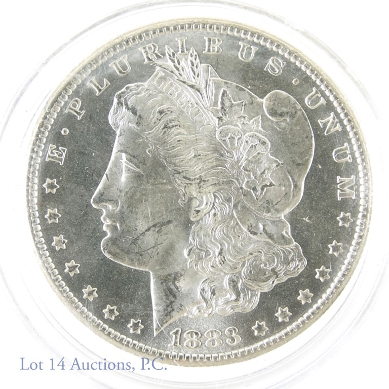 1883-CC Silver Morgan One Dollar (BU?): 1883-CC silver Morgan one dollar coin (BU?). (Carson City Mint) Metal is 90% silver (electronically verified on our metal tester.) Mintage 1,204,000. PCGS' survival estimate is 700,000 in all grades. 