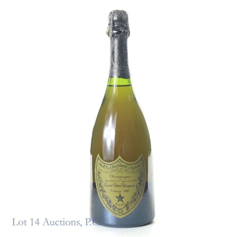 1982 Dom Perignon Vintage Champagne: Cuvee Dom Perignon Champagne, 12.5% ABV, 750 ml, Vintage: 1982, Small tears in foil seal, overall seal is intact, cork is sealed and intact.
