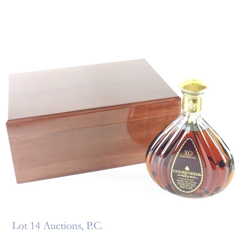 Courvoisier Imperial Cognac & Humidor Case: Courvoisier XO Imperial Cognac, 80 Proof, 750 ml. Wooden cigar humidifier case included with Evermoist Humidifier System. Type of wood unknown, but in good condition.
