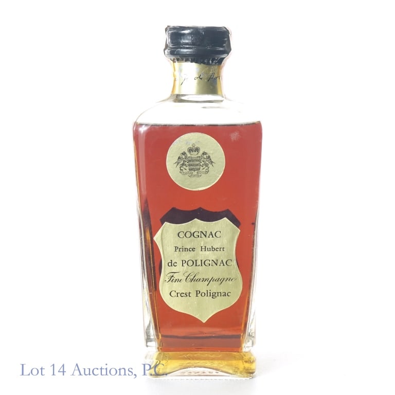 Prince Hubert de Polignac Cognac: Prince Hubert de Polignac Fine Champagne Coganc, 80 Proof, 4/5 Quart. Slight staining and minor tears on tax strip, overall intact and in fair condition. Bottle filled above the shoulder.