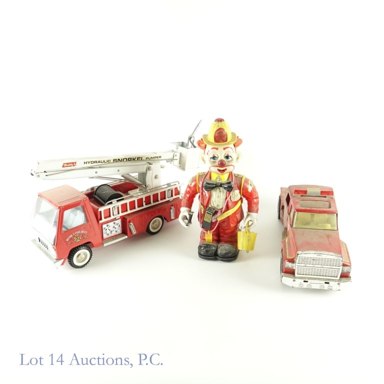 Fire Trucks & Fireman Clown: Nylint Engine 885. Approximately 15" long x 5.25" wide at the wheels. Dirt, some oxidation, and may be missing some windows. ***** Buddy L hydraulic snorkel pumper. Some wear. One fire extinguisher mi