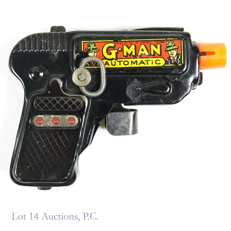 G-Man Automatic Wind-Up Toy Pistol: G-Man Automatic wind-up toy pistol. Toy does wind, and makes noise when trigger is pulled. Black. Orange tip. 4.5" long. 3.5" tall.