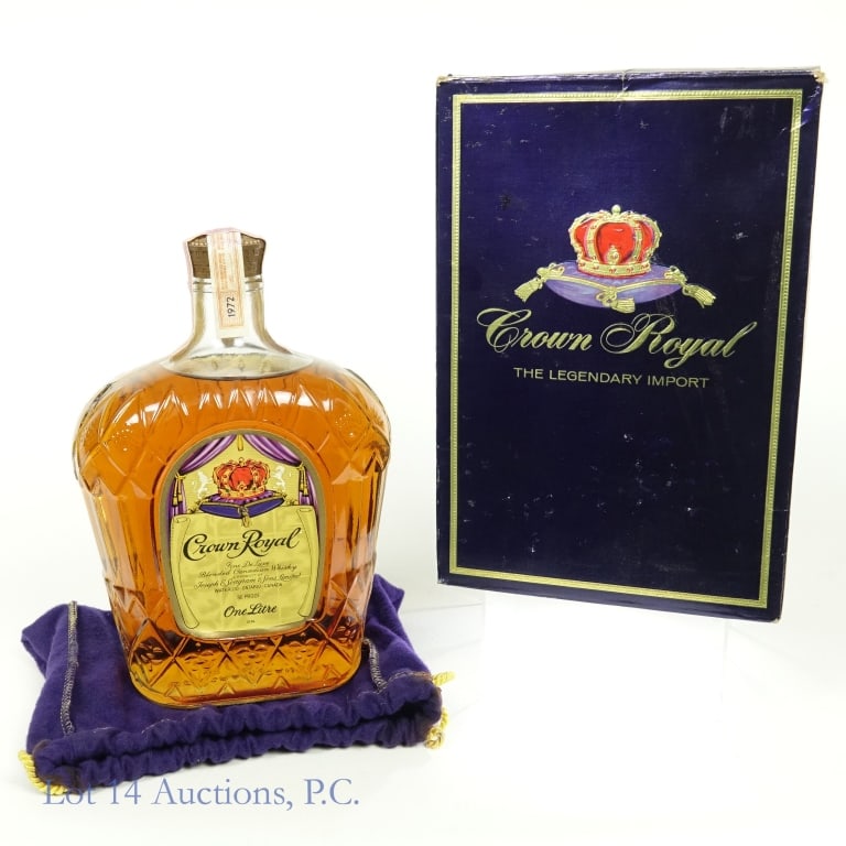 1972 Crown Royal Canadian Whisky (Litre - Box): 1972 Crown Royal fine deluxe blended Canadian whisky. 80 proof. 1 litre. Purple drawstring bag and original (rough condition) box.