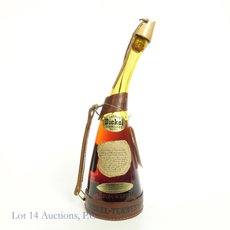George Dickel Ten. Whisky - Reopen Souvenir Bottle: 1964 George Dickel Tennessee whisky. 90 proof. 1/4 gallon. Souvenir bottle for the first bottling after re-opening the distillery. Series 112 (Internal Revenue) tax strip (1960 - 1977). Gold foil for 
