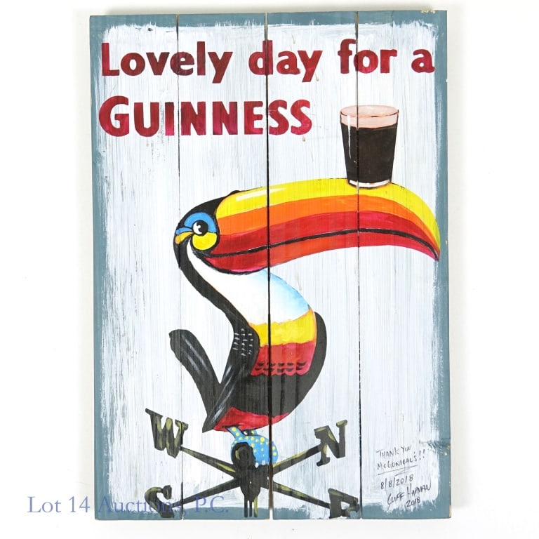 Hand Painted Guinness Ad on Wood (Toucan): Hand painted (on wood) reproduction of the classic Guinness ad featuring a toucan perched on a weather vane balancing a glass of Guinness on the beak headlined with "Lovely day for a Guinness". This p