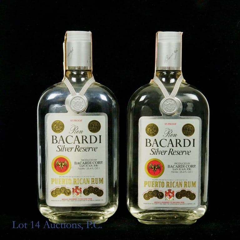 Bacardi Silver Reserve Rum "Ron Bacardi" (2): Two bottles of (Ron) Bacardi Silver Reserve Puerto Rican Rum. 85 proof. 750 ml (25.4 fl oz). ATF tax strip (1983 - 1985).