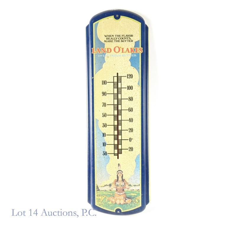 Old Land O' Lakes Advertising Thermometer: Older tin Land O' Lakes advertising thermometer. Measures approximately 26 inches by 8 inches. The colors and graphics remain clear but there is some light surface rust on the front and back surface.