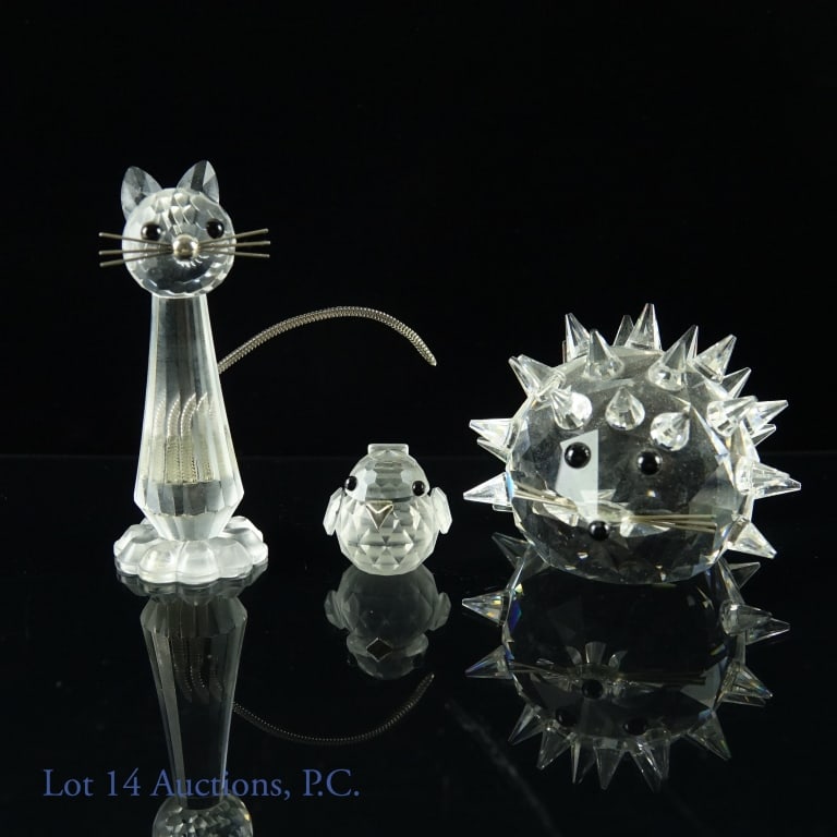 Swarovski Crystal Cat, Hedgehog, Sparrow: Three Swarovski crystal animals. Sparrow #7650 (retired) 1.25" tall, in box. Large sitting cat #7634NR70 (retired) 3" tall, in box. Hedgehog, no box. No damage noted.