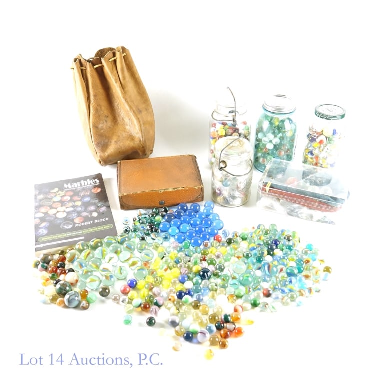 Marble Collections, Book and Bags: Various jars and containers of marbles. Blue glass Ball jar weighed at 3 Ib, 8 oz. Large clear flip lid jar weighed at 3 lb, 3 oz. Francesco Rinaldi jar weighed at 2 Ib, 9 oz. Small Drey flip lid jar