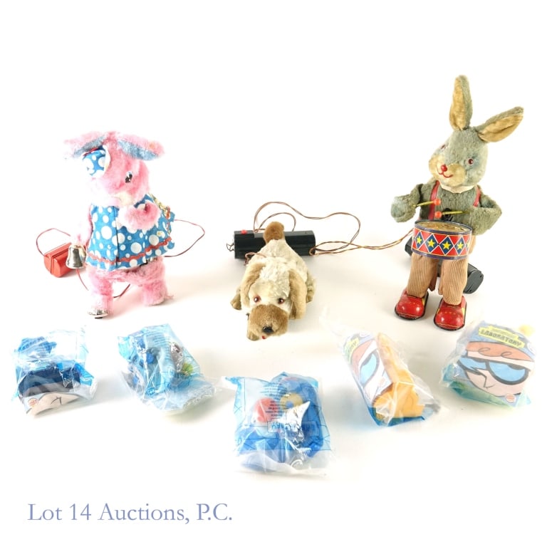 Tin Plushes & Dexter's Laboratory Toys (8): Tin Plushes & Dexter's Laboratory Toys. 3 tin plush toys: 1950s Peter the Drumming Rabbit, pink rabbit with a blue polka-dot dress and bell, and golden puppy. All with remotes. Color fade and wear, dr
