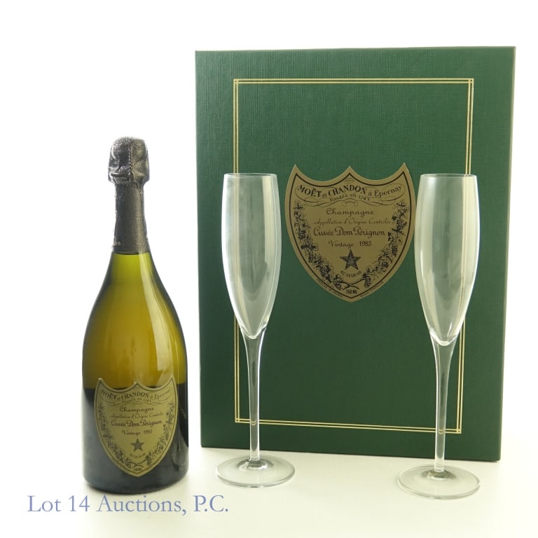 1985 Dom Perignon Brut Champagne Gift Set: 1985 Dom Perignon Brut Champagne, 12.5% ABV, 750 ml, Vintage: 1985. Gift Set includes 2 crystal champagne flutes. Case included to hold bottle and glasses in good condition. Wine stored in basement by