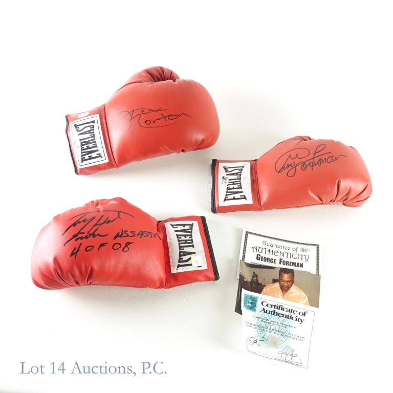 Norton / Foreman / Holmes Signed Gloves (JSA): Ken Norton Signed Boxing Glove / George Foreman Signed Boxing Glove / Larry Holmes Signed Glove (JSA COA - 2 Boxing Gloves) (JSA Certification: WPP025396 / J25329). Lot 14 guarantees the authenticity 