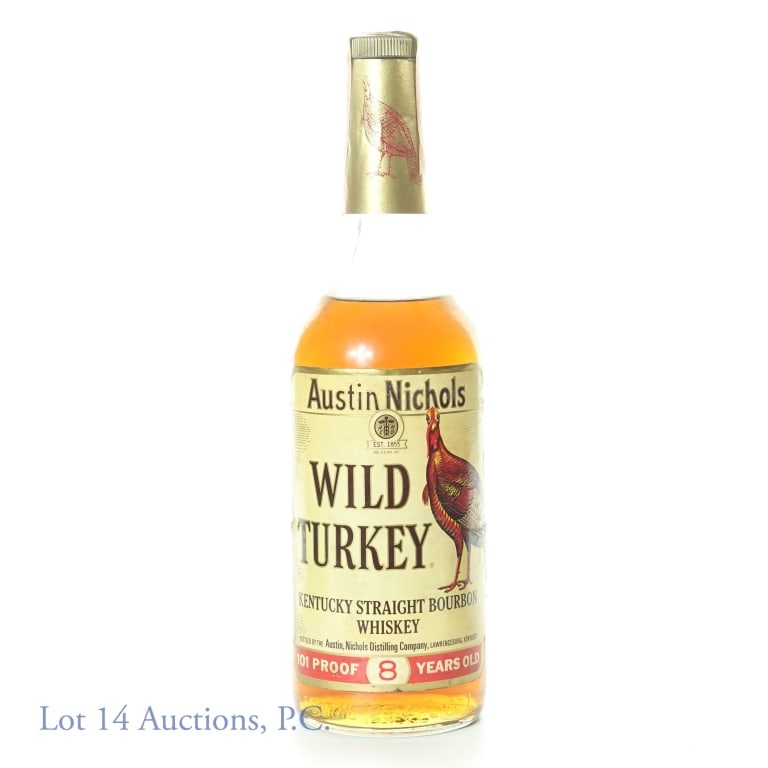 Wild Turkey 8 Yr Austin Nichols Bourbon (1980s): Austin Nichols Wild Turkey Kentucky straight bourbon whiskey. 8 years. 101 proof. 750 ml (25.4 fl oz). Non-series ATF tax strip (1983 - 1985). "84" glass molding.
