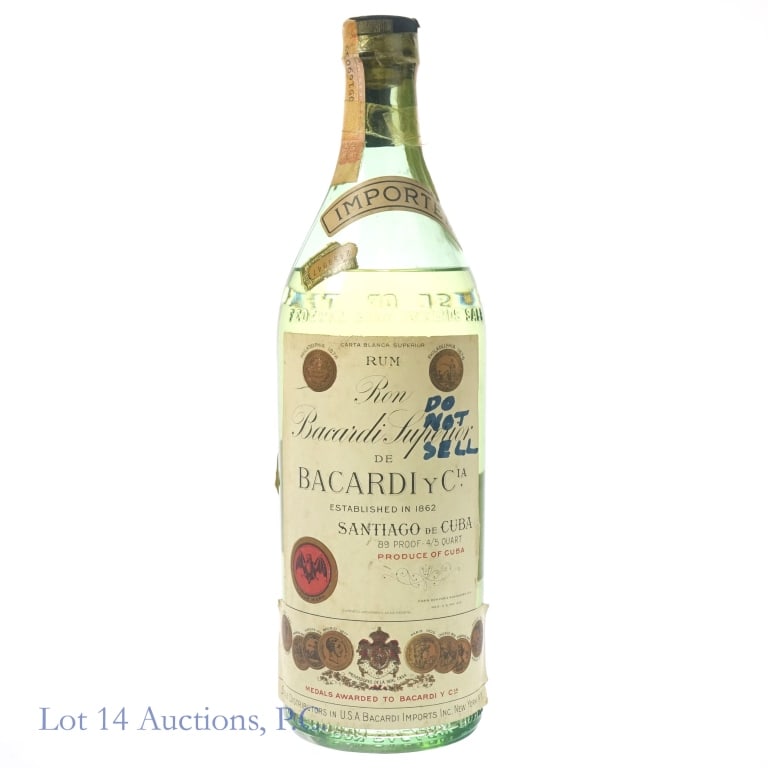 Bacardi Carta Blanca Superior Rum (Pre-Embargo): 1-Ron Bacardi Carta Blanca Superior Cuban Rum, 89 Proof, 4/5 Quart. 1940s bottling. Front label peeling on bottom edges, wear on back label. "Do Not Sell" written in blue marker on front label. Tax st