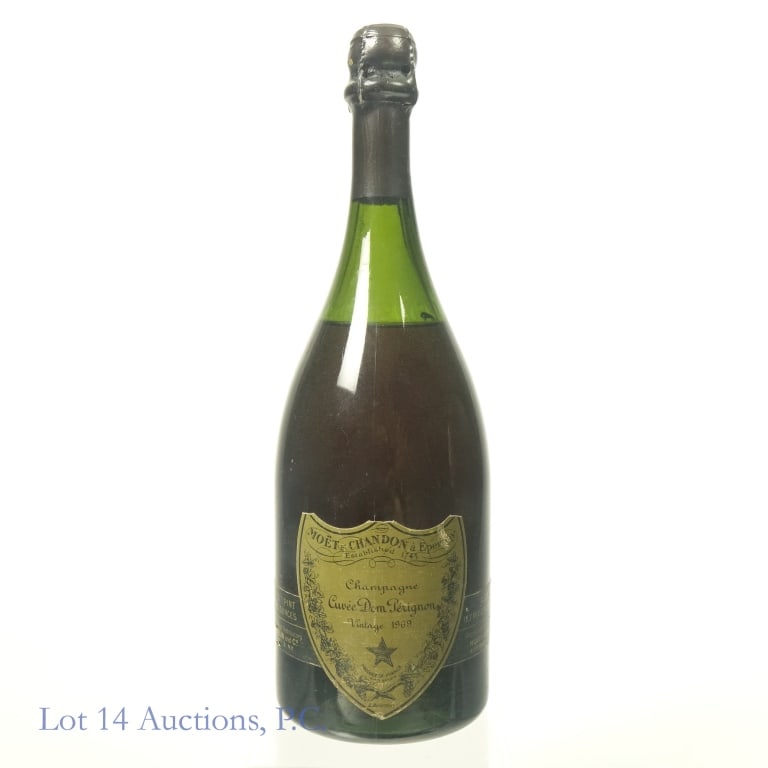1969 Dom Perignon Brut Champagne: 1969 Dom Perignon Brut Champagne, 12.7% ABV, 750 ml, Vintage: 1969. Fill at shoulder level. Very minor cork exposure. Original owner stored wine in basement.