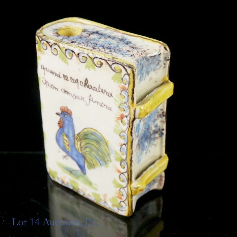 French Earthenware Snuff Box: French Earthenware Snuff Box in the shape of a book titled "Amite" meaning friendship. Shows rooster on one side and flowers on the other in soft blue, yellow, and white color tones. "Quand ce coq cha