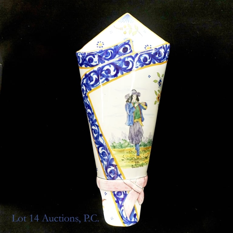 HB Quimper French Earthenware Wall Pocket: Quimper French Earthenware Wall Pocket displaying traditional Brittan gentleman playing a musical instrument along the French countryside. Blue floral patterns encompass the overall border of the wall