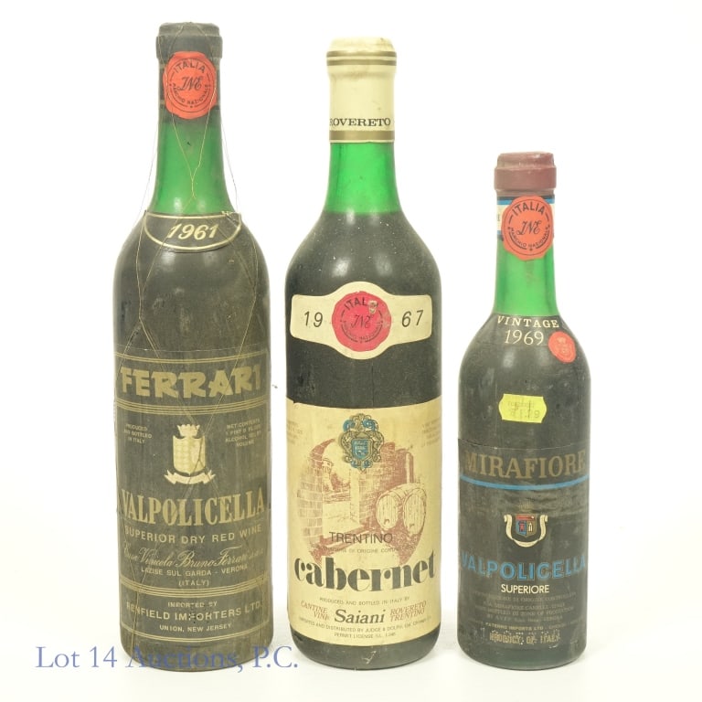 1961, 67, 69 Italian Valpolicella & Cabernet (3): 1-1961 Ferrari Valpolicella Superior Dry Red Wine, 12% ABV, 1 Pint, 8 Ounces, Vintage: 1961, Region: Verona, Italy. Fill right below base of neck. 2-1967 Saiani Rovereto Trentino Cabernet, 13% ABV, 1 