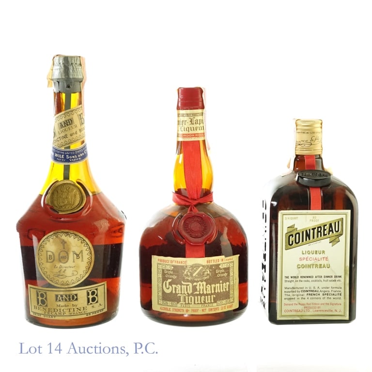 60s/70s B&B DOM Brandy, Grand Marnier & Cointreau: 1-B&B DOM Brandy, 86 Proof, 23/32 Quart, 1960s-1970s bottling. Tax strip completely torn through on one side. Other side has very minor tears but remains intact overall. Front label badly stained and 
