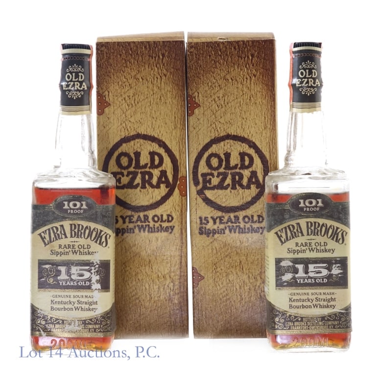 77 Ezra Brooks 15 Yr Bourbon (2, 200 ml): Ezra Brooks 15 Year 101 Proof Bourbon, 101 Proof, 200 ml, "77" glass molding (x2). Both bottles have wear and residue on front and back labels, one back label has fallen off completely and is placed i