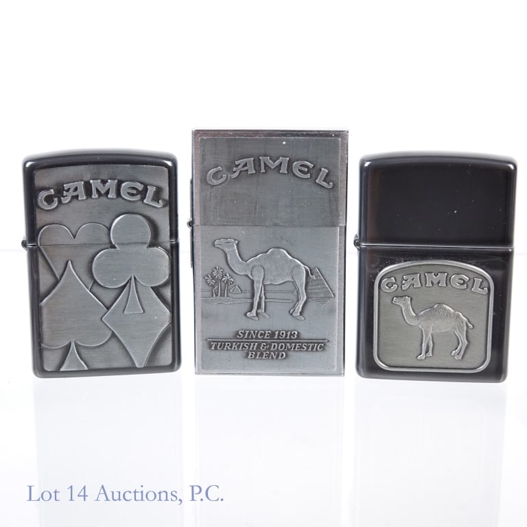 Camel Zippo Lighters (3): Camel Zippo Lighters (3). Four Aces Camel - 1996, appears unfired. Camel Zippo. 1996, appears unfired. Camel original 1932 replica, second release (1997). Not tested in house. Please see photos for mo