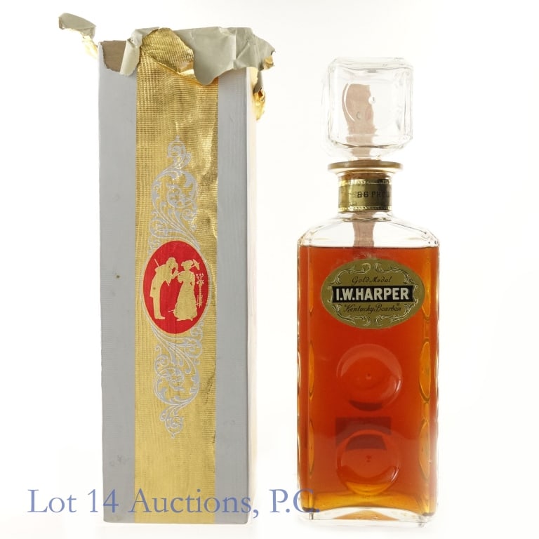 "64" IW Harper Gold Medal Bourbon Decanter**: I.W. Harper 6 Year Gold Medal Bourbon Decanter, 86 Proof, 4/5 Quart. "64" glass molding***Cloudy liquid, tax strip broken through and decanter is OPEN. Fill level slightly below shoulder. Original box