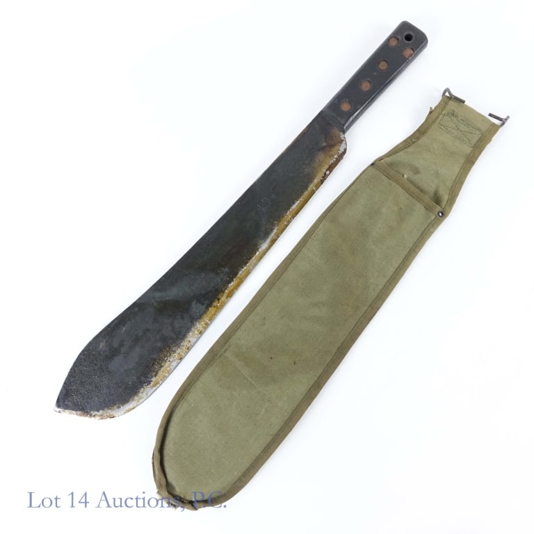 1945 J.J.B. Machete - WWII Era Militaria: 1945 (World War II era) J.J.B. British-made machete. Approximately 14.5" blade. Marked "J.J.B 1945" with a wide arrowhead. Includes green soft (rougher condition) sheath.