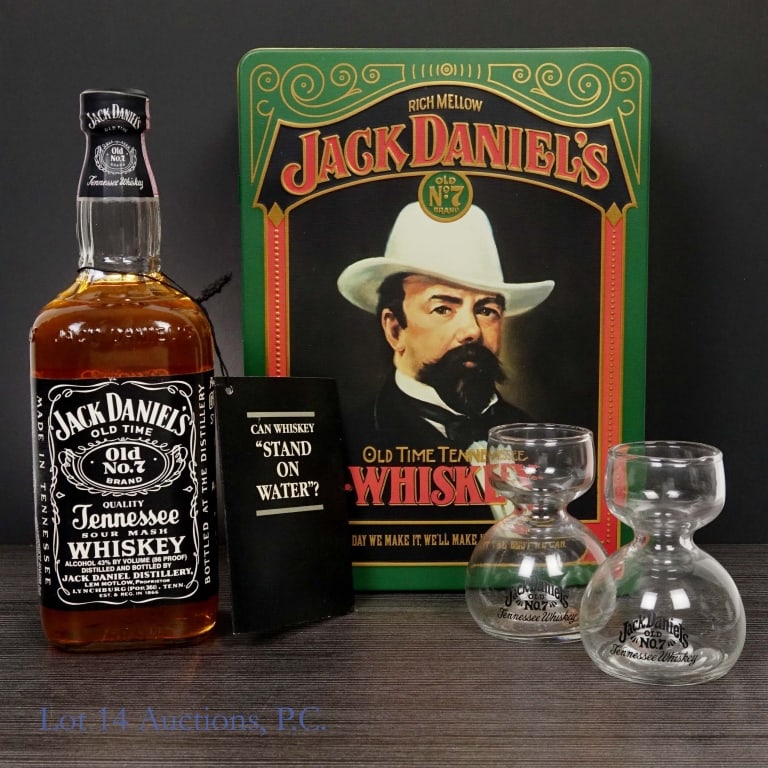 90s Jack Daniel's Whiskey Jigger Gift Set and Tin: Jack Daniel's Tennessee Whiskey, 90 Proof, 750 ml, "91" glass molding. Gift set includes 2 Jack Daniel's "sipper jiggers". Gift set housed in vintage Jack Daniel's tin case, case in very good conditio