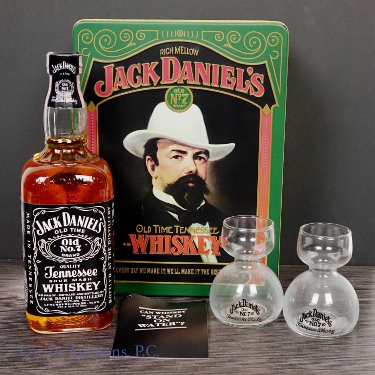 80s Jack Daniel's Whiskey Jigger Gift Set and Tin: Jack Daniel's Tennessee Whiskey, 90 Proof, 750 ml, "86" glass molding. Gift set includes 2 Jack Daniel's "sipper jiggers". Gift set housed in vintage Jack Daniel's tin case, case in very good conditio